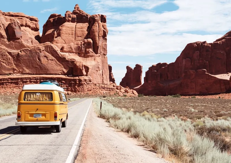 Winding road through high desert landscape with mountain views in Central Oregon